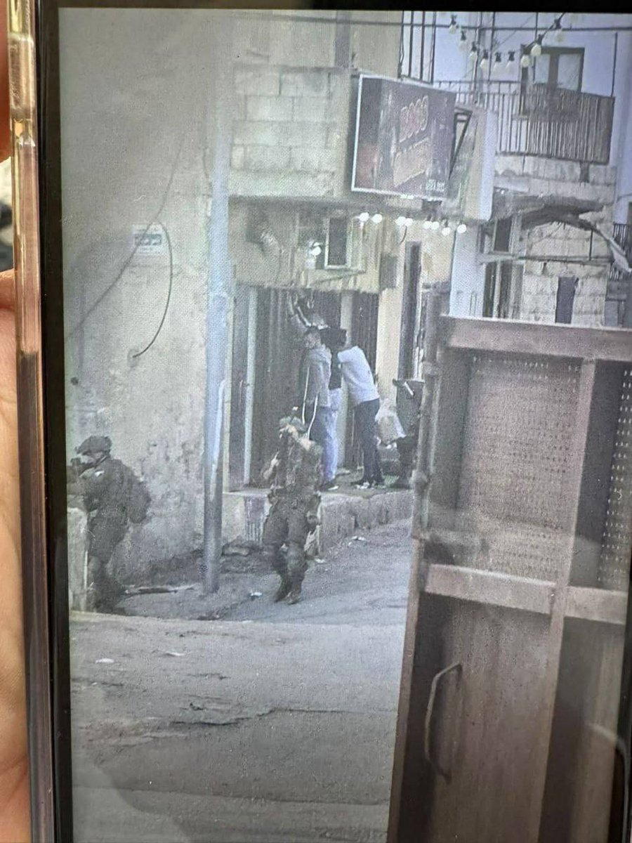 Occupation forces detain a group of young men during a raid on the town of ‘Anin, west of Jenin in the northern West Bank.