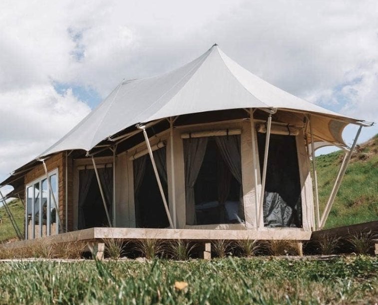 4 layers of roofing here. Did you know that about an Exclusive Tents? We call it a “Multi layer roofing system”

How it works: The part of the roof system that you can see in the picture here is a “shade fly”. This layer softens the sound of rain and other weather. It’s creates