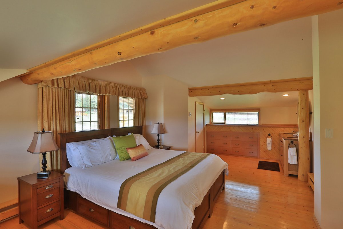 Immerse yourself in the charm of the fully restored ranch house. With its modern decor, ample space, stunning views from the wrap-around deck, and a fairytale-like staircase. evranch.com