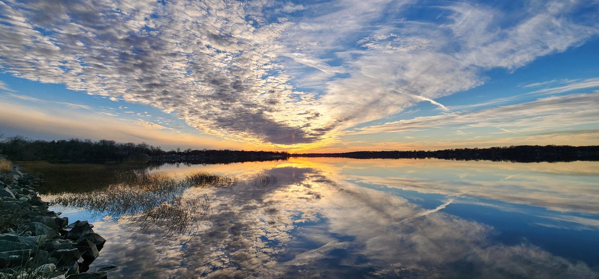 Took a drive knowing this view changes abruptly and drastically tomorrow as winter arrives. I'm sitting here on the rocks watching the sun go down #LakeLife