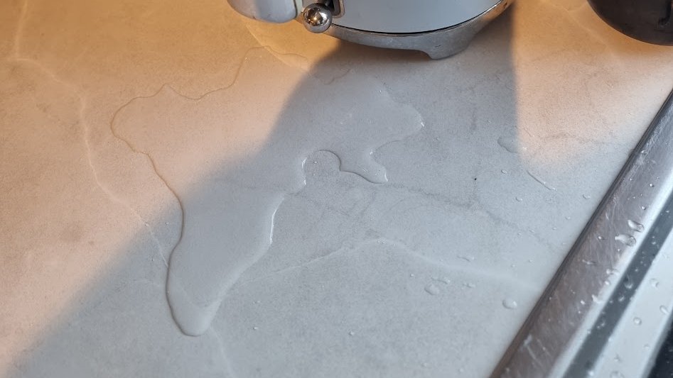 higginsdavidw's tweet image. Carlow-shaped puddle on the kitchen counter
