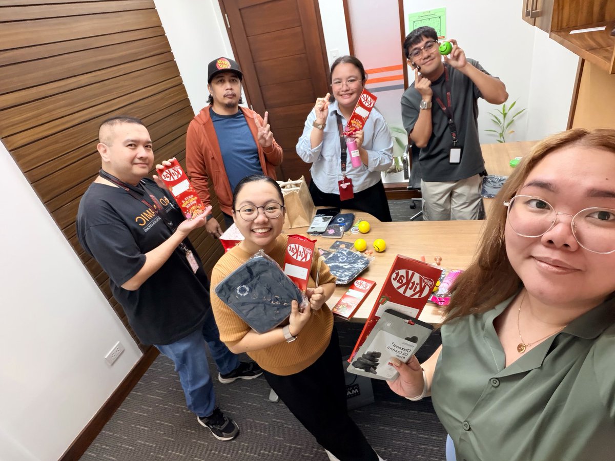 Mykel_Sanchez's tweet photo. Our themes for today's "Secret Santa" at the office were "something funny" and "something of your favorite color". There was nothing secret about the "process" though, as we all dumped our gifts on the table for everyone. #EmpoweredWithDBOS #HappyHolidays2025 #FoodPhotography https://t.co/xvU8uEJuEK