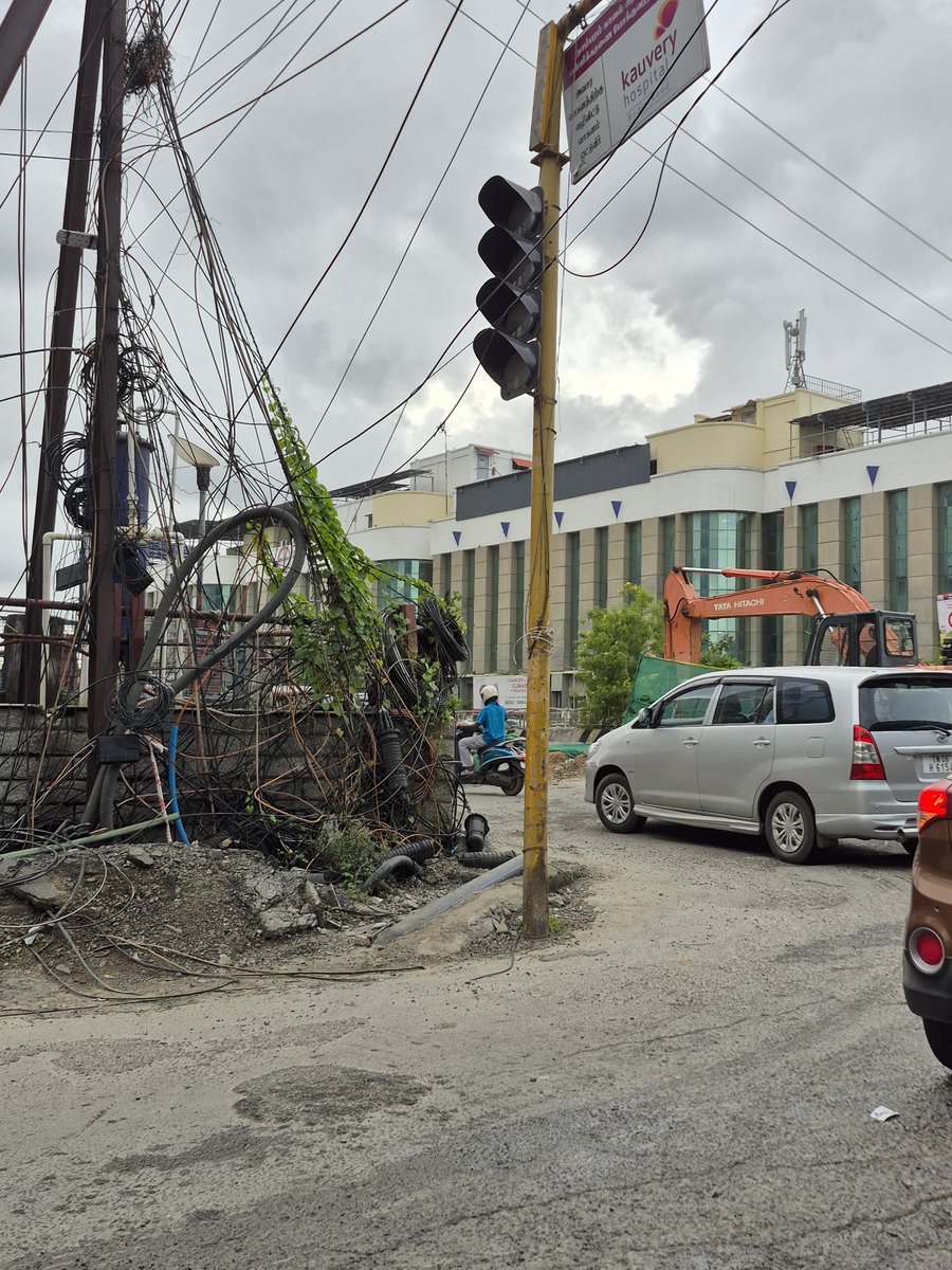 Exposed cables, Broken road edges, No proper footpath at Kamakshi Hospital junction, Pallikaranai under flyover. Kindly clear the debris, fix the cables, and restore a safe pathway for pedestrians &amp; daily commuters.
#PublicSafety #Pallikaranai
<a href="/chennai_Highway/">Highways (C & M) Chennai Circle</a> <a href="/chennaicorp/">Greater Chennai Corporation</a>