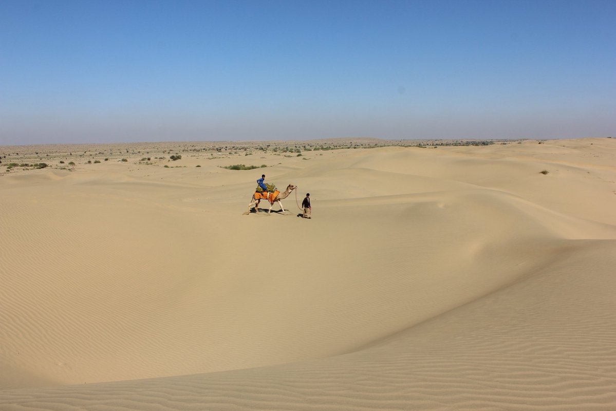 Tribal boys, no school in this uninhabited desert, they tend to their camels, and help their parents survive.  
Shot on: Canon 
Photography: Manish Gupta