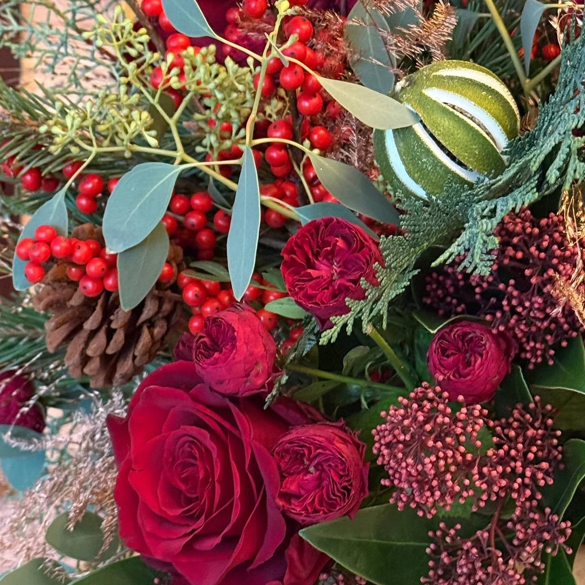 Bringing festive magic to your home with the Pulbrook &amp; Gould Christmas Collection. First up is The Rudolph- a glorious mixture of luxurious red roses, santini, skimmia and ilex berries sitting amongst pine cones and lots of winter foliage. Shop the collection online.