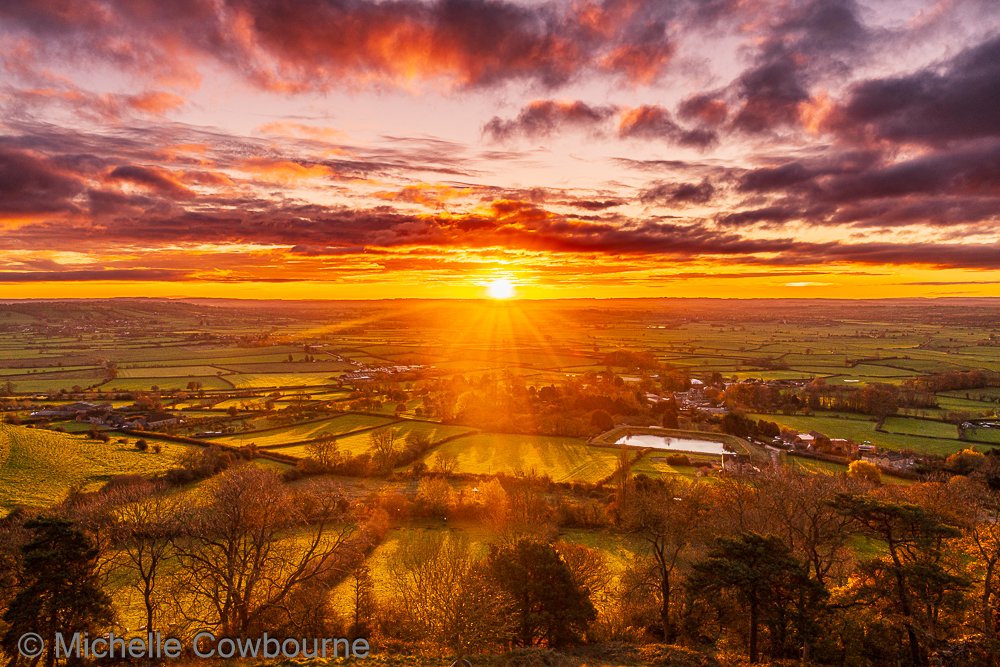 Sunrise from Glastonbury Tor this morning. The fields below bathed in that first golden light of the day. A sense of tranquility and calm.