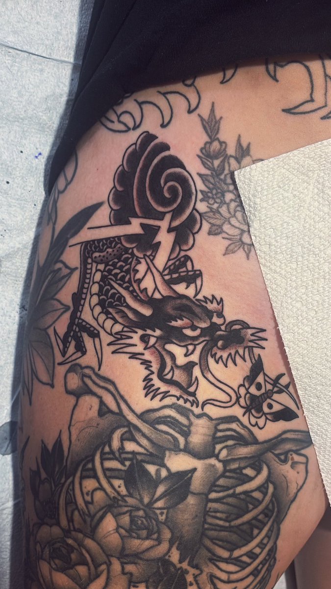 The head of the Dragon is based off a design from the book that Prof. York put out of an unknown antique flash book that he found of a Japanese tattooers from the late 1800s the rest is drawn on to fit