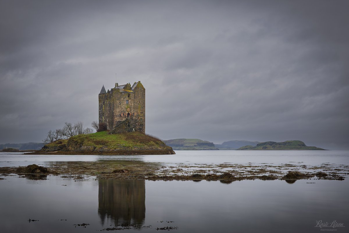 We'd been at Castle Stalker from the very first hint of morning light. Instead of a sunrise the clouds rolled in thick and we got soft, muted, sombre greys. 
#castlestalker #scottishhighlands #landscapephotography