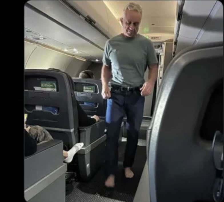 caringguy1957's tweet image. Aside from the hilarious contrast of seeing @RobertKennedyJr in jeans, a T shirt, and barefoot on an airplane right after Sean Duffy lectured everyone that we should “dress up to fly” because somehow that would make flying safer, let’s talk about the real issue.

Can you imagine…