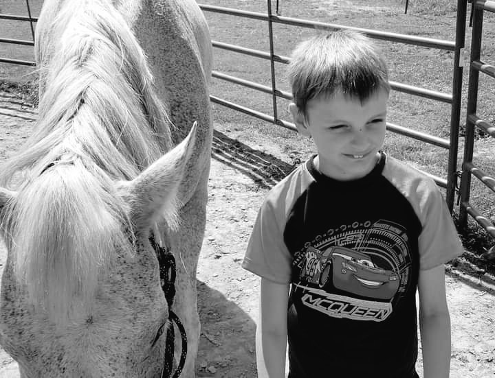The whole world paused this morning. Do you know why?  

Because a little boys tank was empty. 

All the kids had already started their lessons with the horses and I was getting the ponies ready when I noticed one of my clients standing in a stall wiping his face. 
I paused for a