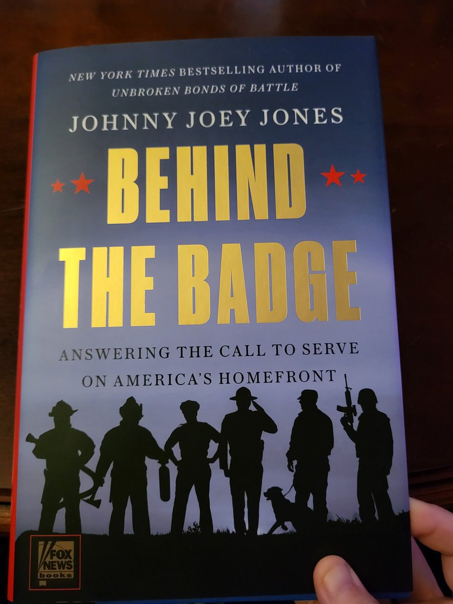 Reading my signed copy of Behind the Badge! Thanks <a href="/Johnny_Joey/">Joey Jones</a>!