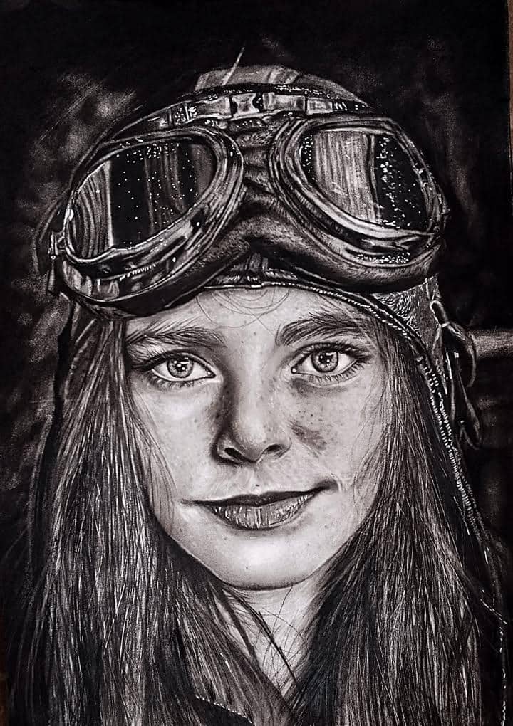 LucidSznnn's tweet image. Blessing, known as @bseffect_, is a multidisciplinary artist creating realistic pencil and painted works that capture human personality.

In Aviator Gaze, her calm eyes and lifted goggles symbolize quiet strength and ambition. someone ready to rise no matter how high the sky