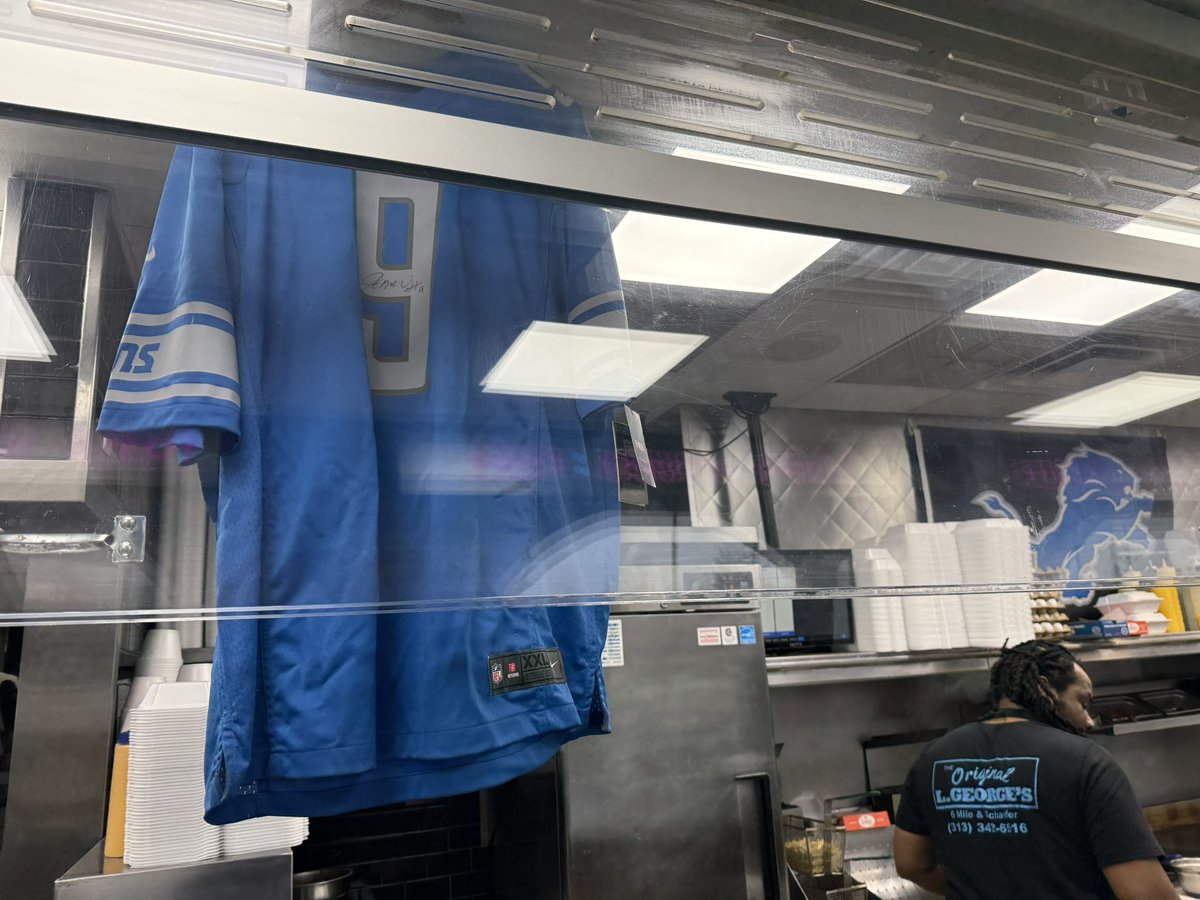 I dropped by randomly for a chicken pita and they really got #Lions WR Jameson Williams’ jersey hanging in the rafters at L. George's Coney Island on 6 Mile in Detroit. 🔥