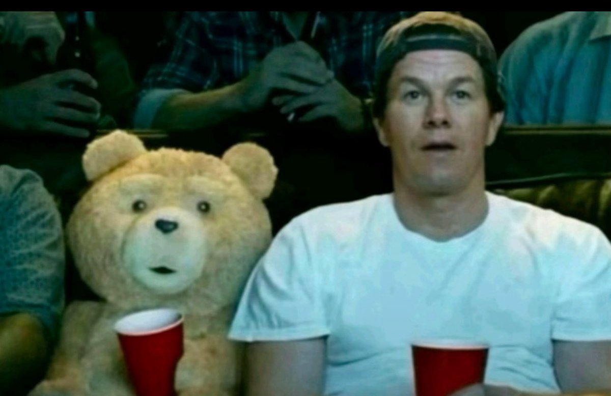 Ted and Mark Wahlberg watching cinema in surprise