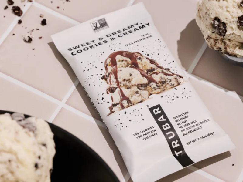 cpgwire's tweet photo. TRUBAR, a Vancouver-based purveyor of clean nutrition bars, has been acquired by Turkish food company ETİ Gıda for $201M CAD.

TRUBAR, which was founded by Erica Groussman in 2019, retails at more than 15,000 doors across the U.S. 

Revenue surpassed $50M in 2024 and the company expects to hit $100M in 2026.

There’s been a lot of deals in the protein bar space lately and more to come in 2026:

- BUILT Bar hired bankers
- Ferrero Group acquired Power Crunch
- 1440 Foods acquired FitCrunch