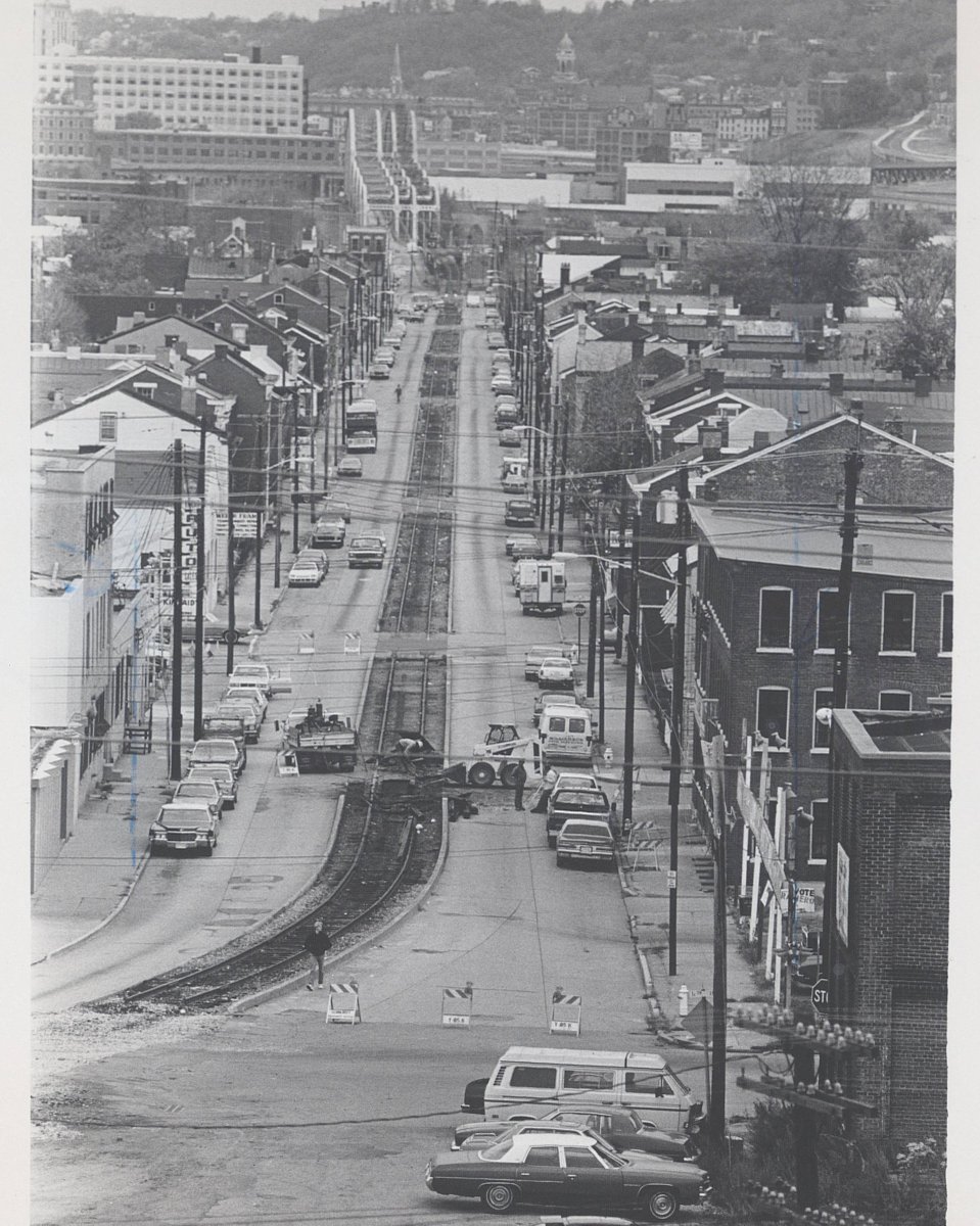 Removing train tracks from Saratoga St. in Newport, KY. 1985.