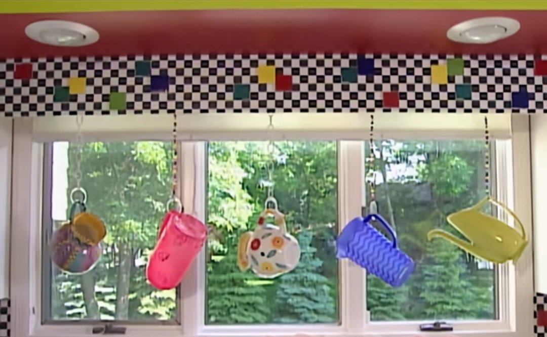 chicnormal's tweet image. forever obsessed with this particular segment on nancy levin's (nate berkus' mom) decorating cents as she hangs these pitchers for a "stained glass effect" and claims the display is useful as it provides a "hint of privacy."