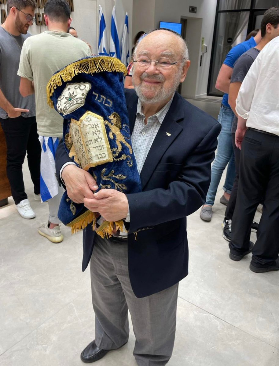 96-year-old Holocaust survivor R’ Yosef Levkovich holds a recovered Torah scroll that was stolen/lost during the Holocaust.
