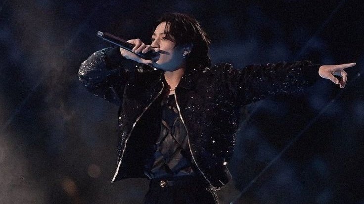 TheePopCore's tweet image. Jungkook has been featured in the Official 2026 FIFA World Cup poster, spotlighting his iconic performance at the Qatar 2022 World Cup as part of a collage of historic moments.