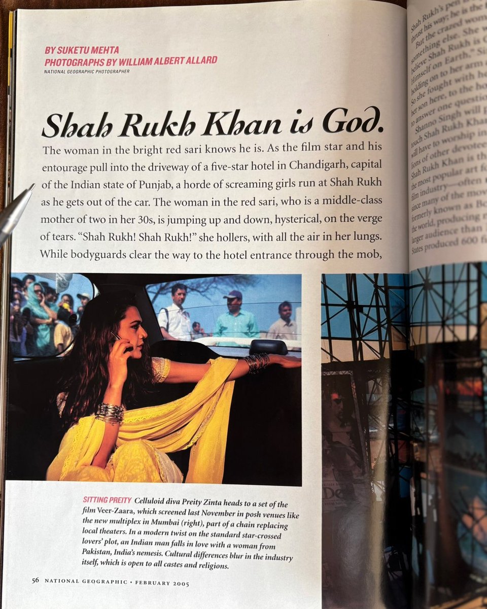 A page from National Geographic magazine featuring an article about Bollywood, discusses the immense popularity and deification of Shah Rukh Khan.