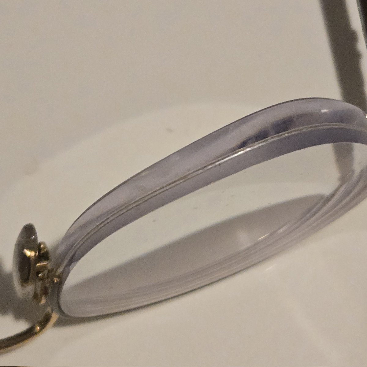 Reinventgender's tweet photo. @deidrejowen Brown (dark brown if that matters?), 22, I have glasses and they are VERY thick, picture of the lens thickness so you can see just how thick https://t.co/qm49ZXjoNc