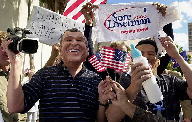 25YearsAgoLive's tweet image. The State of Florida finishes its recount and declares George Bush the winner by just 537 votes. 

Bush fans rejoice, but Al Gore’s team contests the result and demands another recount.