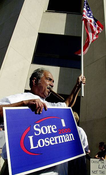 25YearsAgoLive's tweet image. The State of Florida finishes its recount and declares George Bush the winner by just 537 votes. 

Bush fans rejoice, but Al Gore’s team contests the result and demands another recount.