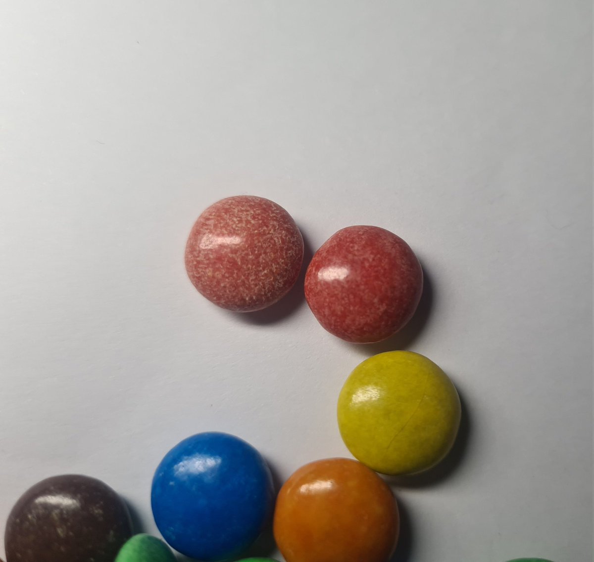 Ajtea2's tweet photo. @NestleUKI bought a pack of m&amp;ms last night. Only ate two because they tasted really off and wrong - not like m&amp;m chocolate normally tastes. Poured them out when I got home and these don't look like normal m&amp;ms... https://t.co/Xm87XQIO8R
