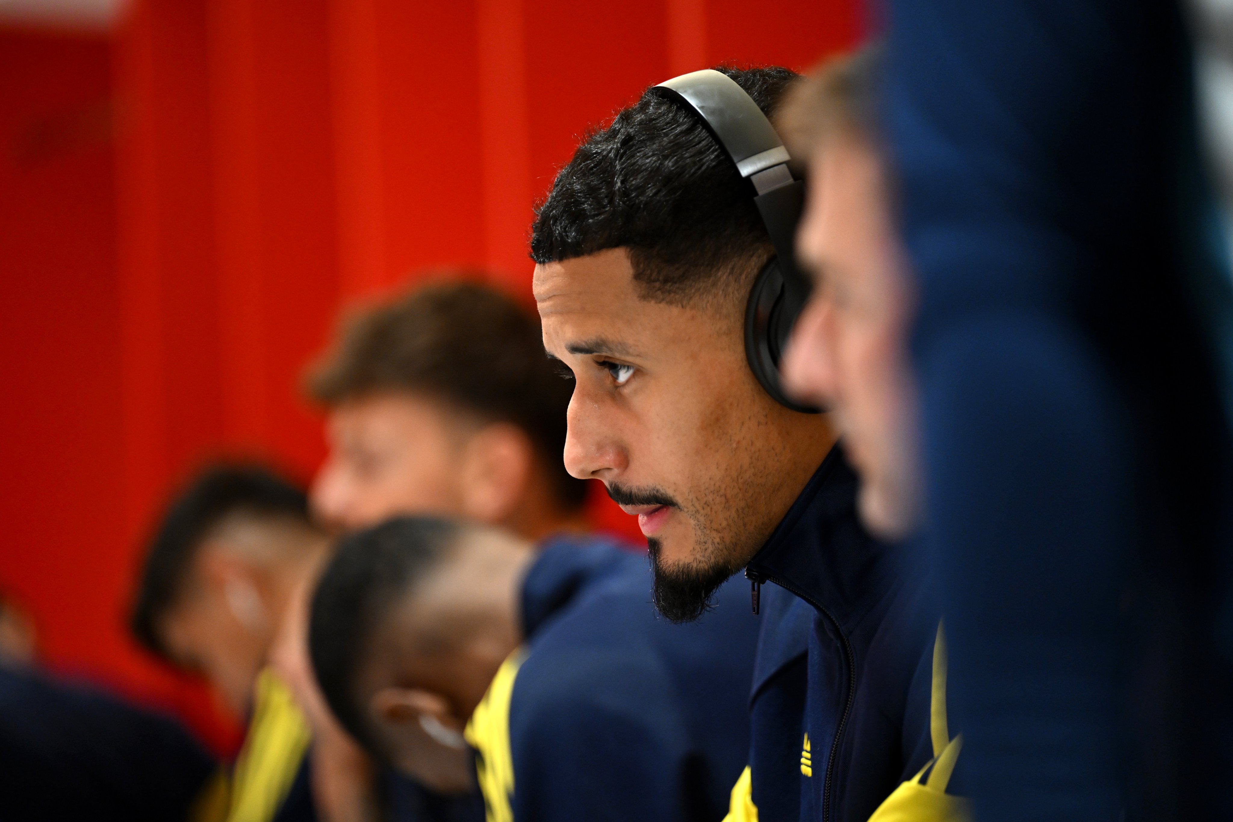 William Saliba looking focused in the dressing room.