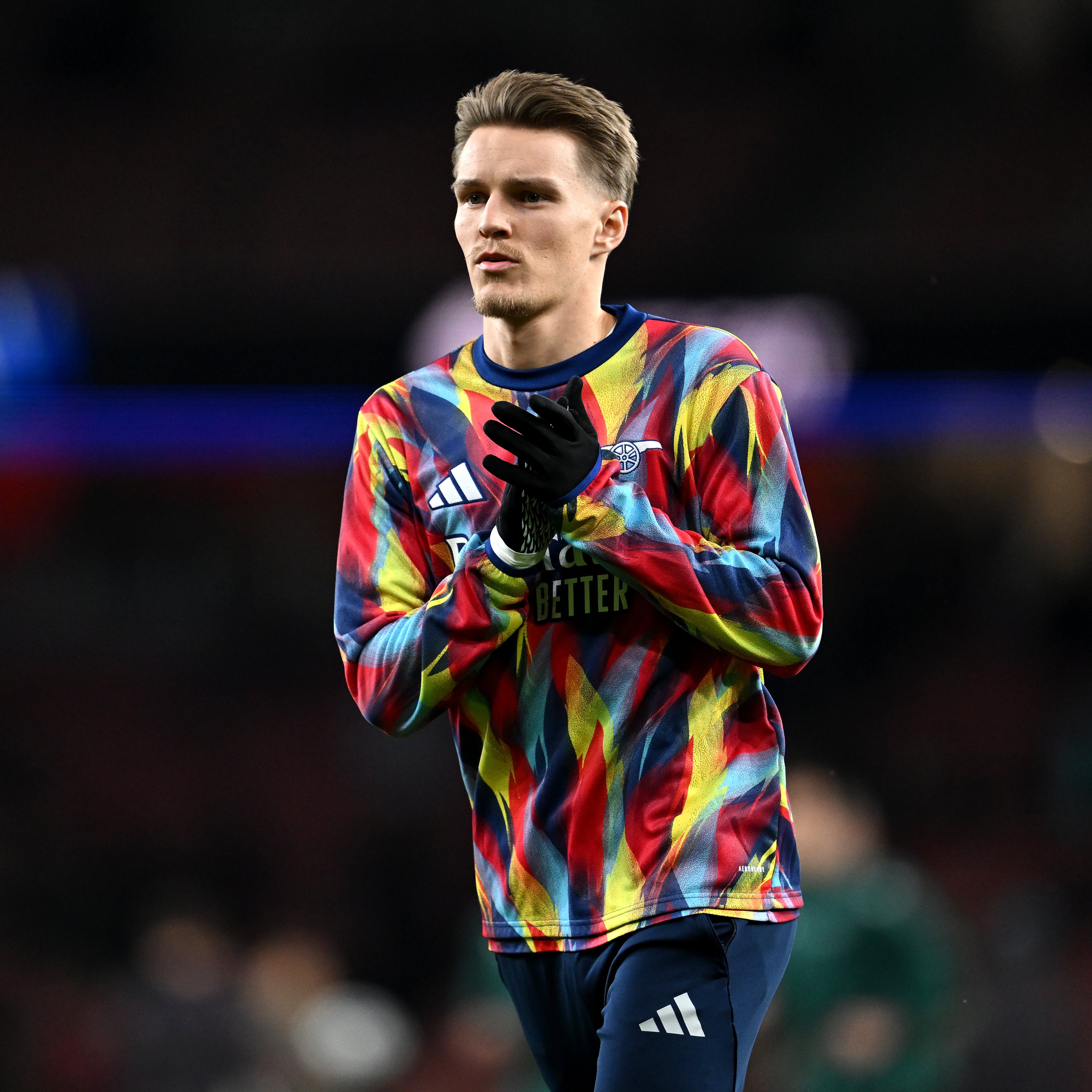 Martin Odegaard applauds the Arsenal faithful.