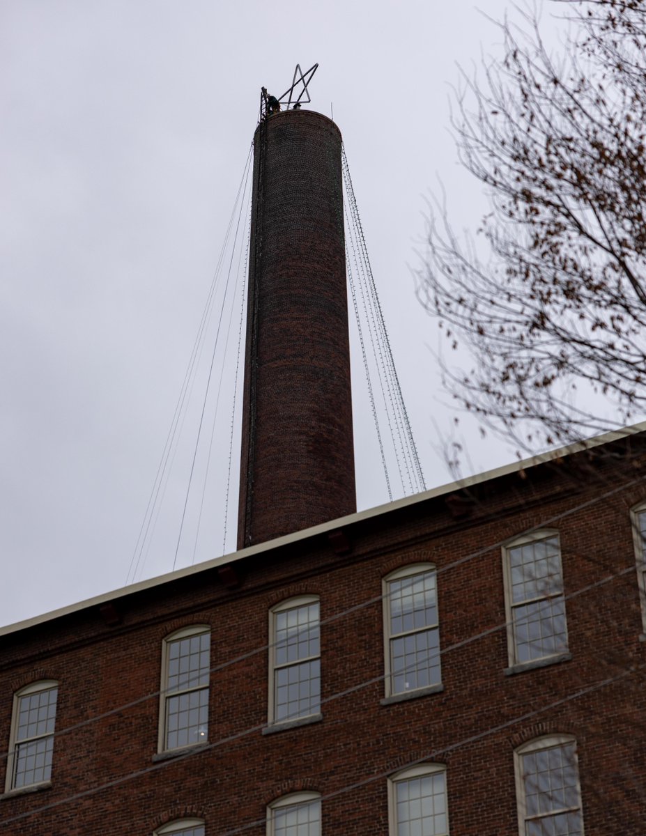 The Wannalancit Mills Smokestack is officially ready for the season! The green lights and star are up — a sure sign that City of Lights is just days away. Make sure you plan your day at lowellcityoflights.org