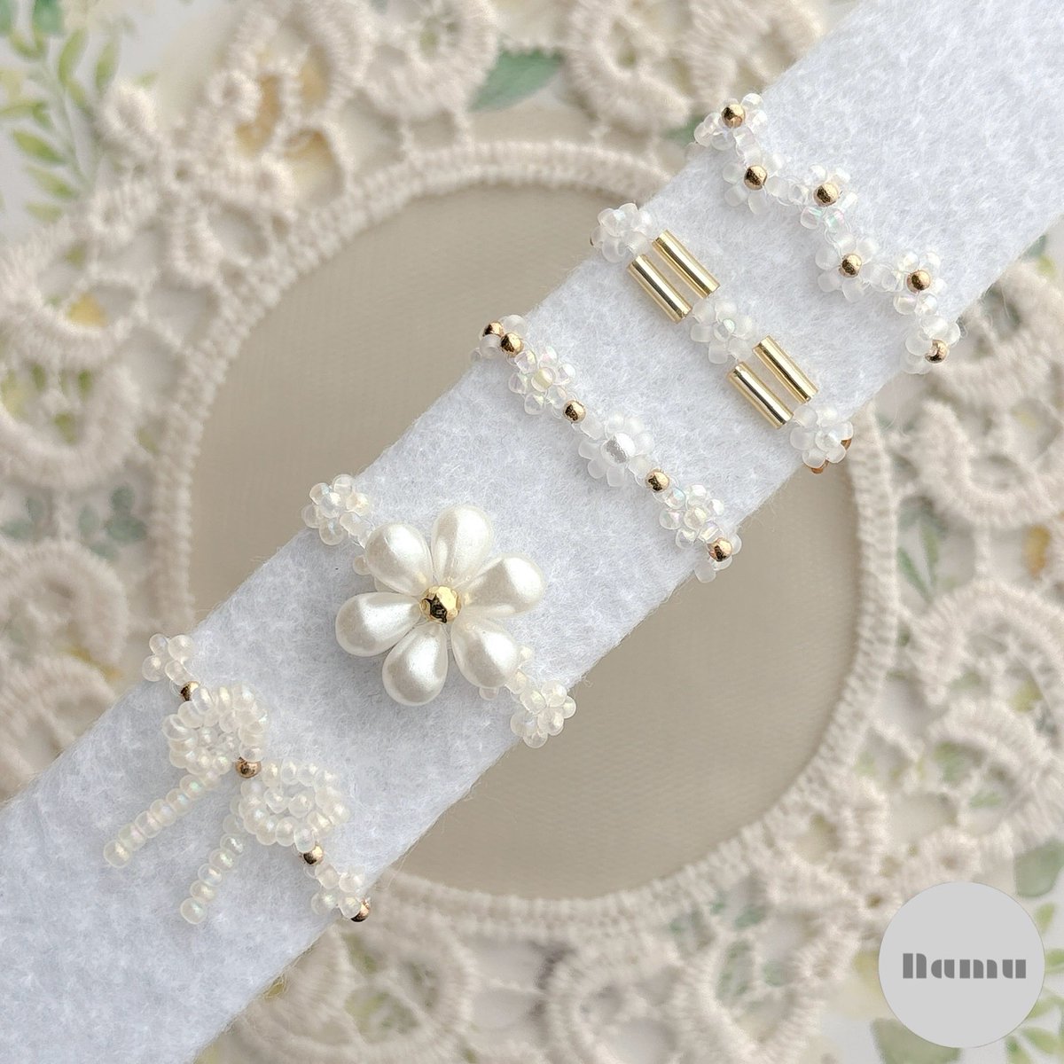 n_a_m_u_76's tweet image. flower and ribbon 🌼🎀

white🤍×gold💛

#Namu #handmade #beads #flower #ribbon #ring #beadaccessory