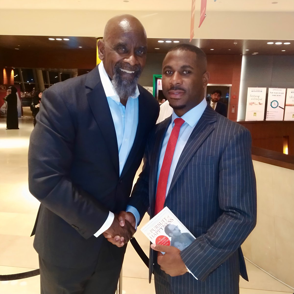 NathanJayJohn's tweet photo. 2019 was one of the toughest years of my life. It was also the year that I had the privilege of meeting @CEOofHappYness at the @Emirates Airline Festival of Literature. That moment helped to reawaken a sense of belief, resilience, and purpose that I had lost.

For many, it was a chance to get a book signed. For me, it was far more than an encounter with the man behind The Pursuit of Happyness. It was a powerful example of how you can continue to hold on to the power of dreaming and convert adversity into fuel for growth.

Chris shared his story and these two lines still echo in my mind today.

• “Become world class in whatever you do.”

• “Want to make the team, go to the gym. Want to own the team, go to the library.”

That encounter reignited my determination to rise above difficulty and to pursue excellence with complete intention. It continues to shape my journey to be one of the best British bankers in the UAE, driven by a commitment to serve, inspire, and lead with purpose.

For anyone unfamiliar, Chris’s story was brought to life on screen by Will Smith in the film The Pursuit of Happyness. It remains a powerful testament to the idea that our dreams are always worth fighting for.

#Leadership #Inspiration #WillSmith #JadenSmith #ChrisGardner #NathanJohn #PursuitOfHappyness #UAE #Banking #EmiratesAirlineFestivalofLiterature #ThrowBack