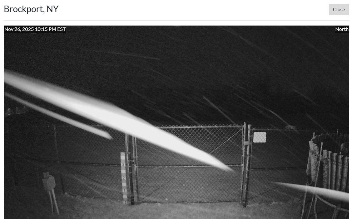 Lake Erie band has reached Rochester's western suburbs on the heals of stiff SW winds.  The snow is wet and pasty.  Main roads just wet but there's stickage on the grass and trees.  Image via the NYS Mesonet.