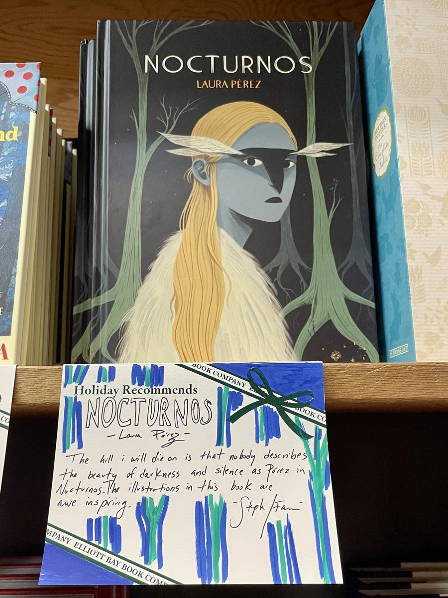 We spy Nocturnos by <a href="/lauraperezgr/">Laura Pérez</a> on <a href="/ElliottBayBooks/">Elliott Bay Book Co.</a>’ wall of holiday recommendations—thanks for the love!
