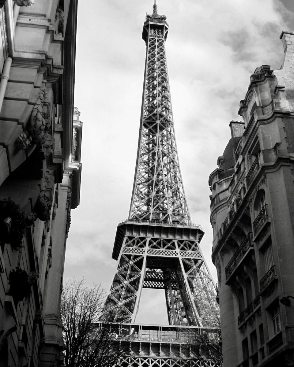 Tripluma's tweet image. Discover the magic of Paris as the iconic Eiffel Tower peeks between charming buildings, inviting you to explore the city&apos;s romance and history. Plan your unforgettable getaway at tripluma.com! ✨ #Paris #EiffelTower #TravelInspiration #Wanderlust