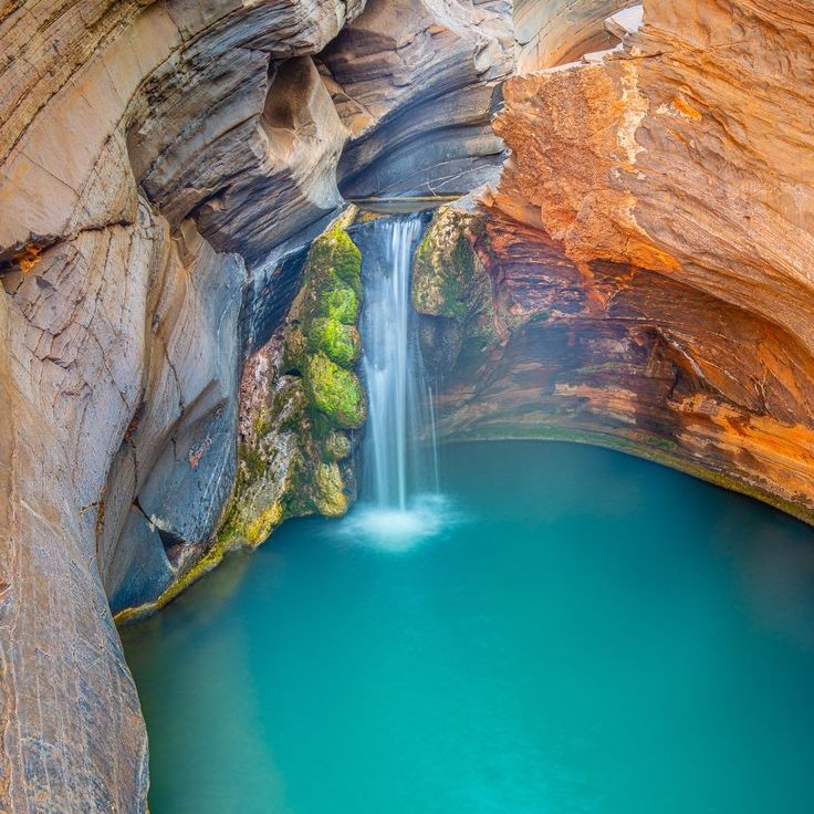 Hamersley Gorge, Karijini National Park.
As you descend into Hamersley Gorge, be greeted with a backdrop of flame-coloured rocks and icy blue water. When the ancient gorge is lit up by the sun it reveals spectacular folds of banded iron formations dating back millions of years!