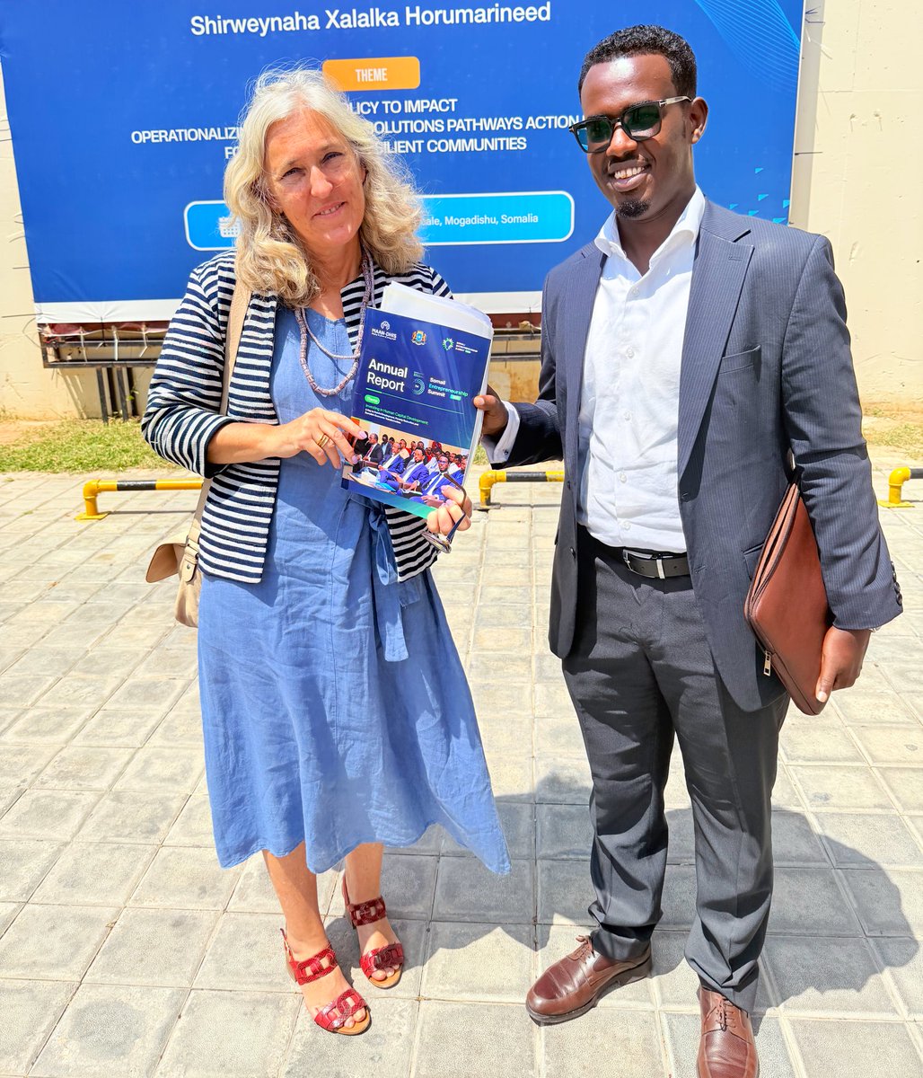 During the concurrent opening of the Annual Durable Solutions Conference, our Director, <a href="/Maandhis_Youth/">𝐌𝐀𝐀𝐍-𝐃𝐇𝐈𝐒 Youth Organization</a>, had the honor of engaging with the European Union Ambassador to Somalia, Amb. <a href="/francescaDM_EU/">Francesca Di Mauro</a>. In this esteemed setting, he presented the annual report of the Somali