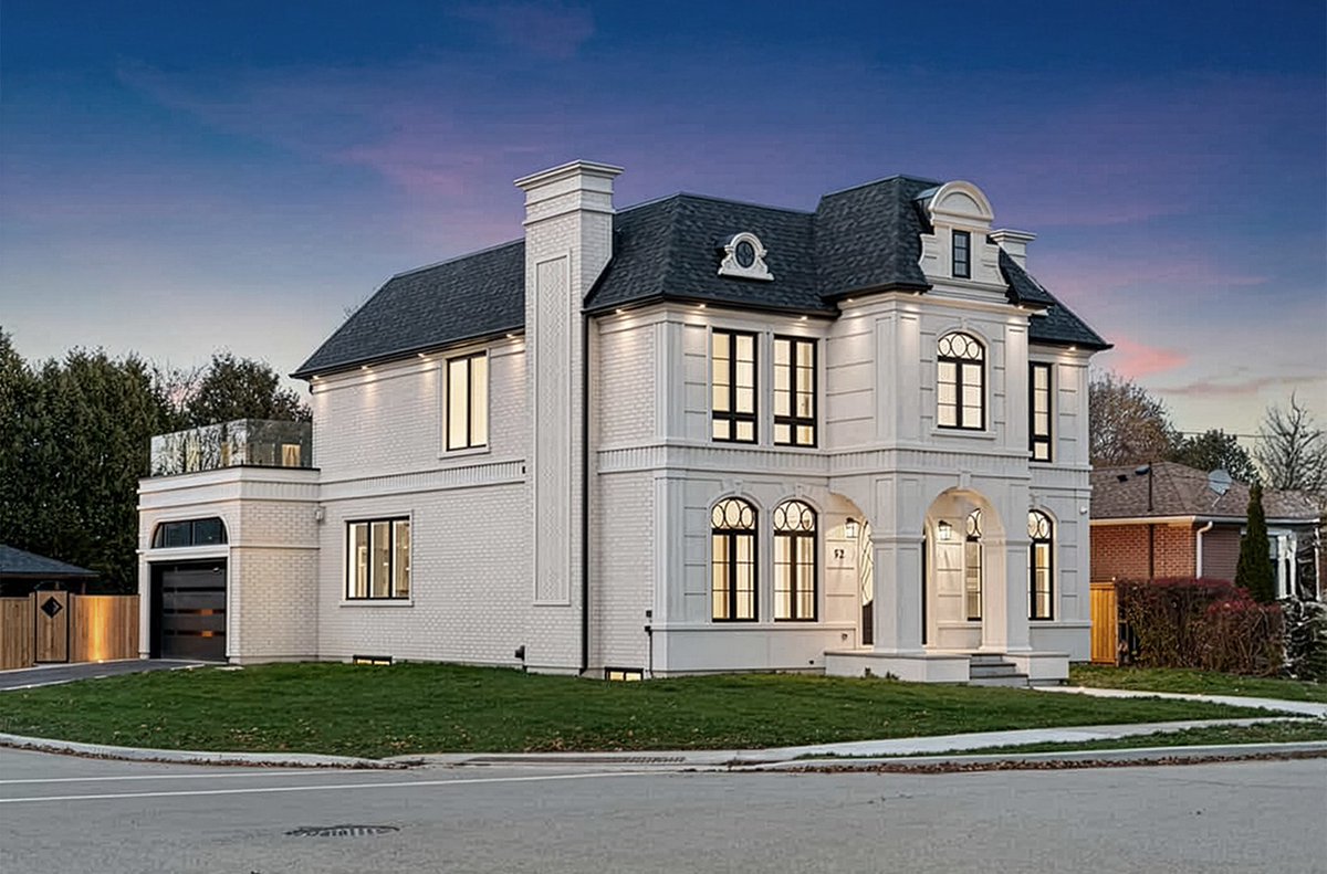 This French Château features a curated mix of window styles, with each window uniquely designed to complement the cladding pattern and the expressive attic architecture. Together, the circular and square elements blend seamlessly, creating a façade that feels like a art piece.