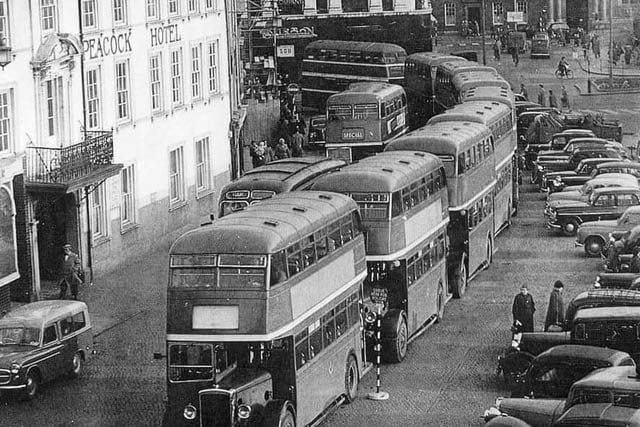 Buses queuing outside the Peacock Hotel, Market Square, Northampton. The hotel was demolished and Peacock Way, shopping precinct built.