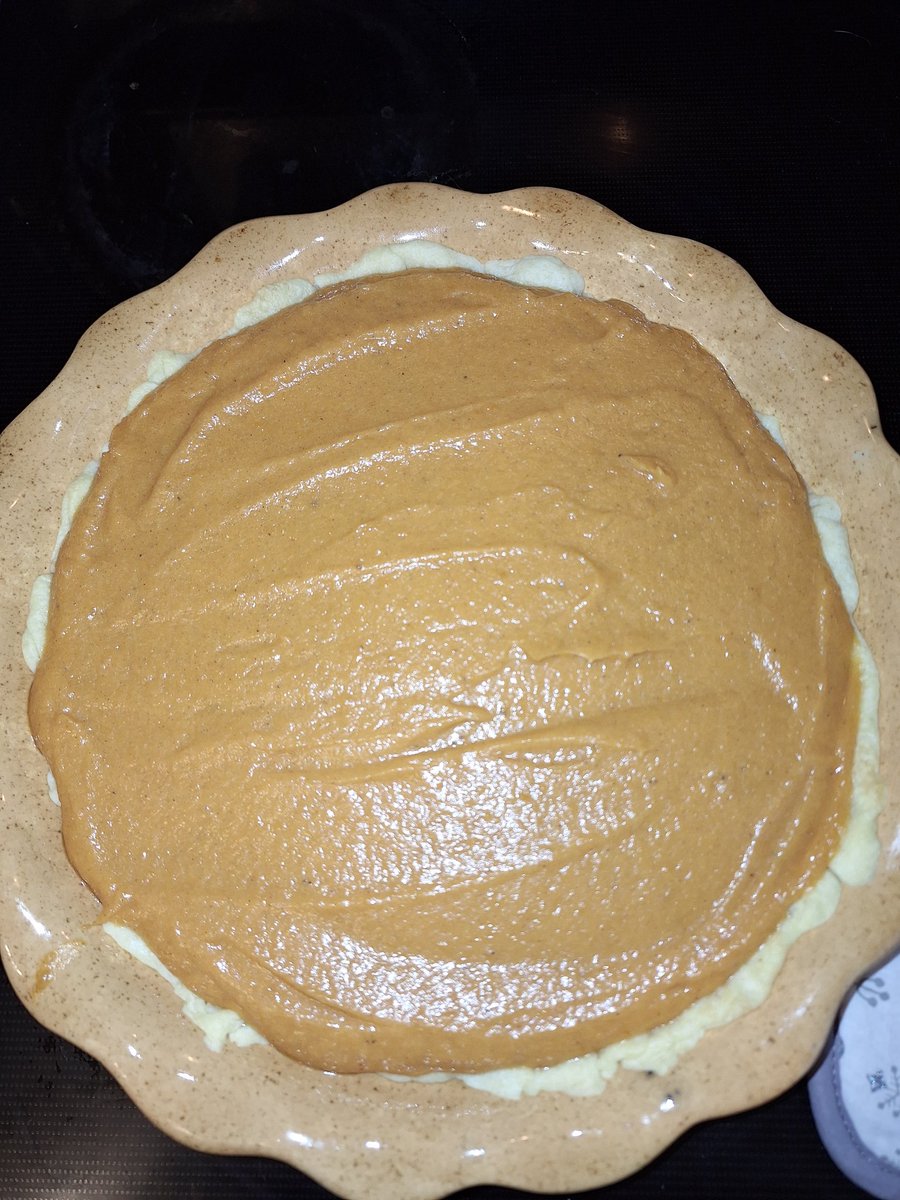 Sweet potato pie going in.  Once a year i break out my mom's ceramic pie dish...made with her own two hands.  Miss u ShellBell!!!