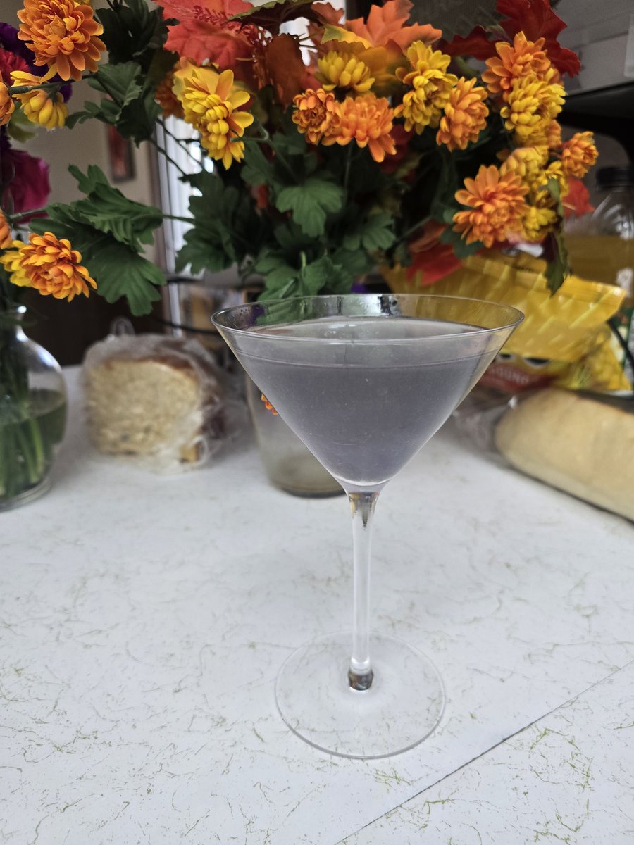 teachrobotslove's tweet image. Thanksgiving prep cocktail: A violet lemon martini.