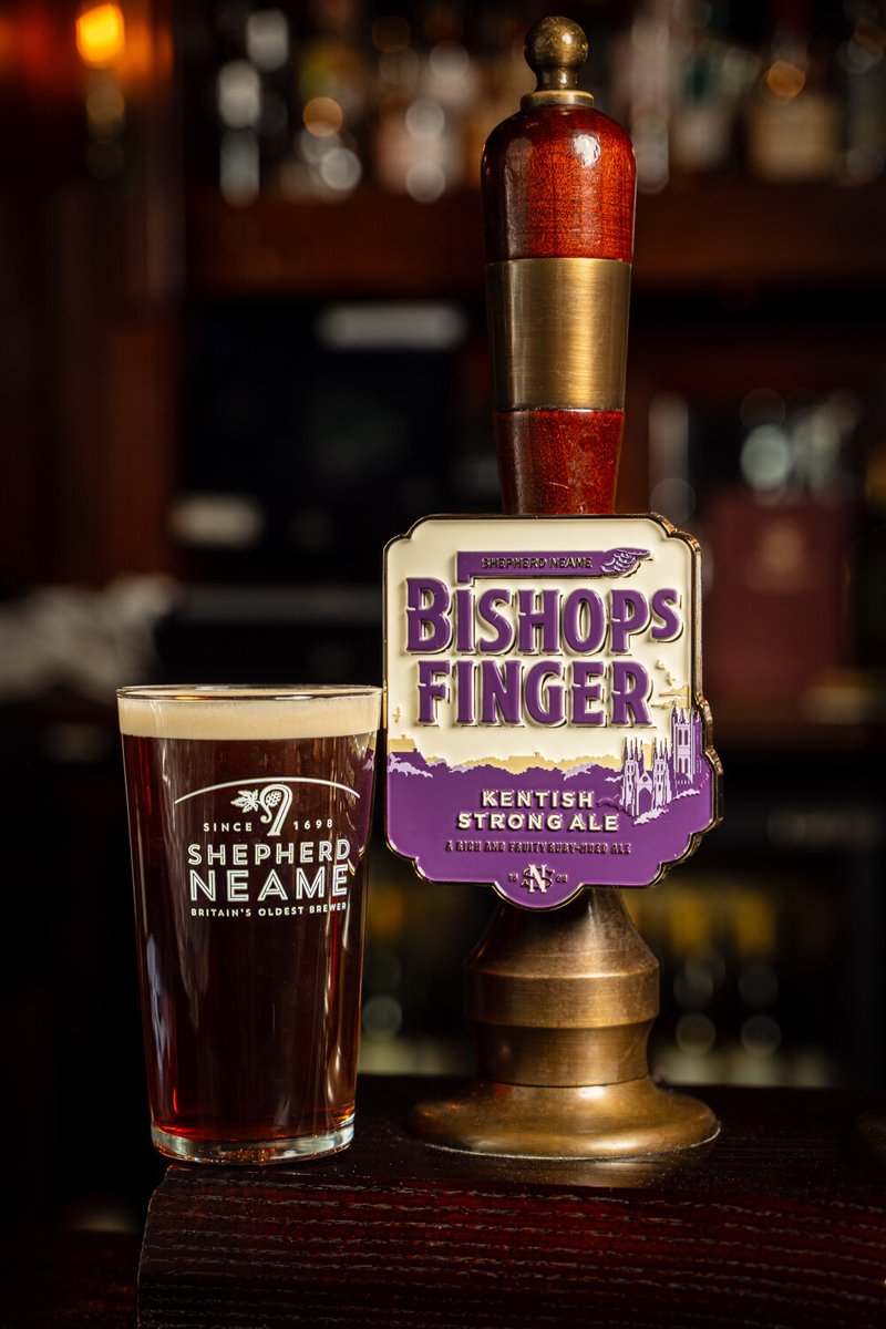 ShepherdNeame's tweet image. Today we're revealing a fresh new look for one of our most iconic bottled ales, Bishops Finger. Retaining its purple, gold &amp;amp; cream colour palette, the new look has a hand-drawn illustration of Canterbury Cathedral. More here: snea.me/refreshed-bish…