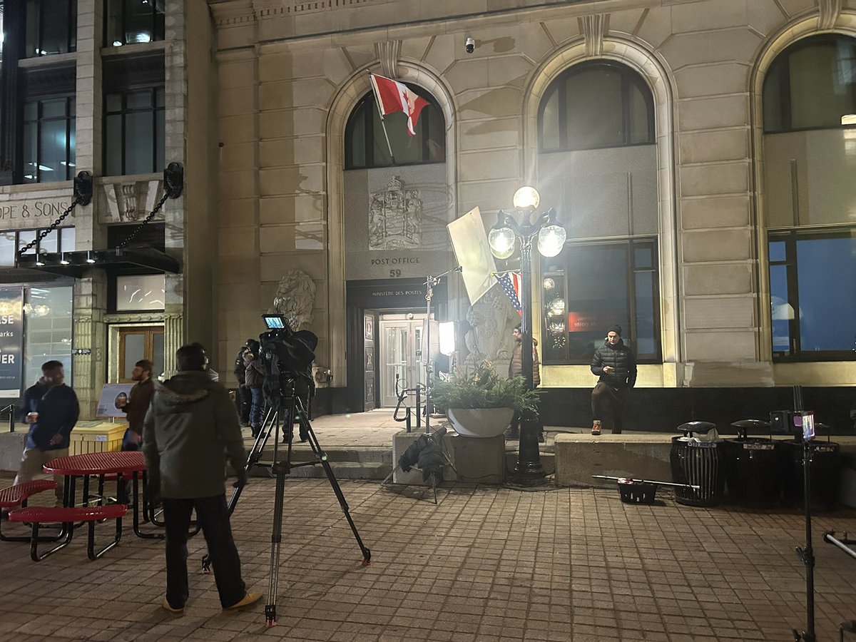 Film crew on Sparks Street, steps from Parliament Hill with American flags, has locals doing double-take. Seems like a Christmas movie.