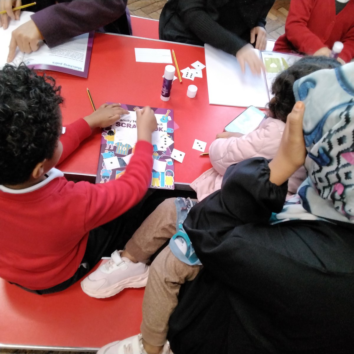LeighPrimary's tweet image. Thank to our Nursery and Reception parents for attending our Help Your Child Love Maths workshop. It was lovely to see the children having fun with the matching sets game and exploring their Maths scrapbooks! #everydaymaths @Nat_Numeracy #memorymakers #parentworkshop