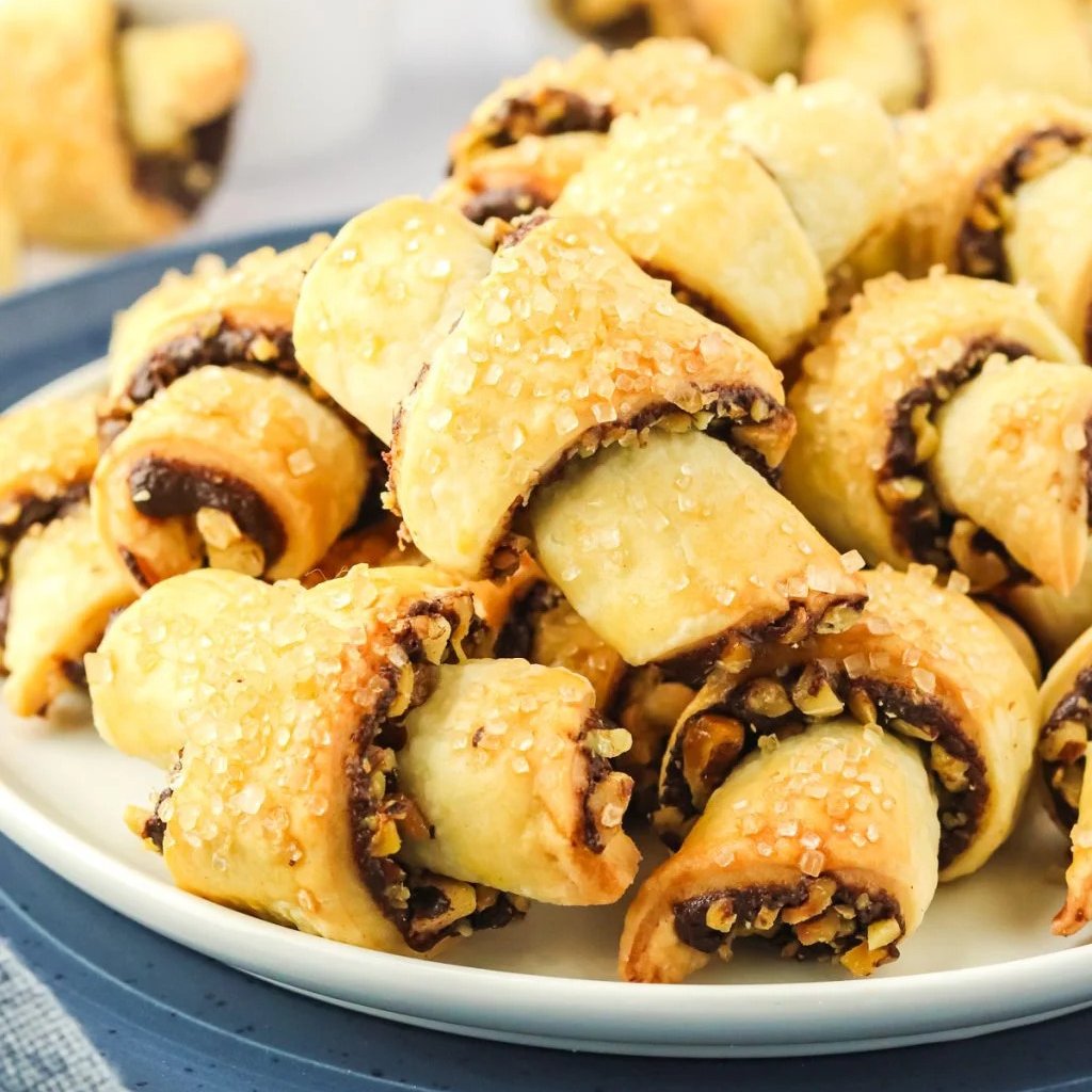 Make rich and delicious Chocolate Rugelach with this easy step-by-step recipe. Perfectly flaky, chocolate-filled cookies every time! #chocolaterugelach #rugelach #chocolate #cookies #Christmas #Christmascookies #baking #holidays #cookieexchange #dessert melissassouthernstylekitchen.com/chocolate-ruge…