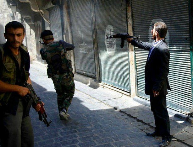 MuzlimsPostingW's tweet photo. A Free Syrian Army fighter in a suit fires at Assad regime forces.

Aleppo, 2013 https://t.co/bBngTJcETd