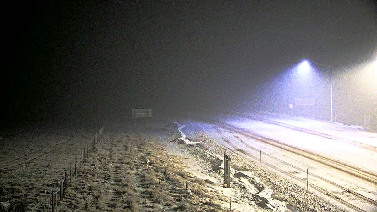 NWSMissoula's tweet photo. 7am MST - Snowy conditions along the Divide this morning as seen from MDT cams at Essex and MacDonald Pass. Prepare for slick conditions if traveling  on #US2 or #US12. Difficult winter travel is more widespread from the Divide eastward.  #mtwx https://t.co/6jBpSSRgel
