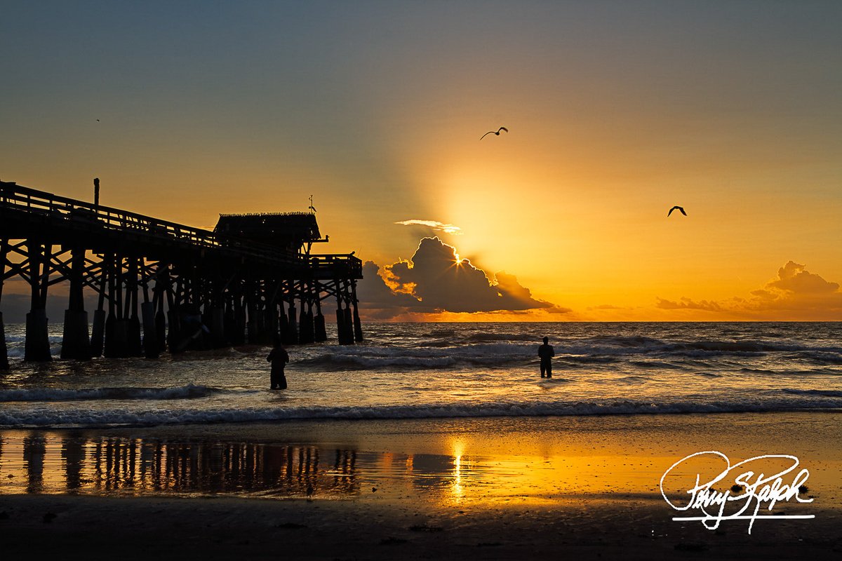QP Photo Challenge: Contrast “Cocoa Beach - Sunburst Reflection” #Sunburst  over the Cocoa Beach Pier. Nothing beats the reflection off the wet sand.  The fisherman is framed perfectly by the light. #CocoaBeach #, image size:1200x800