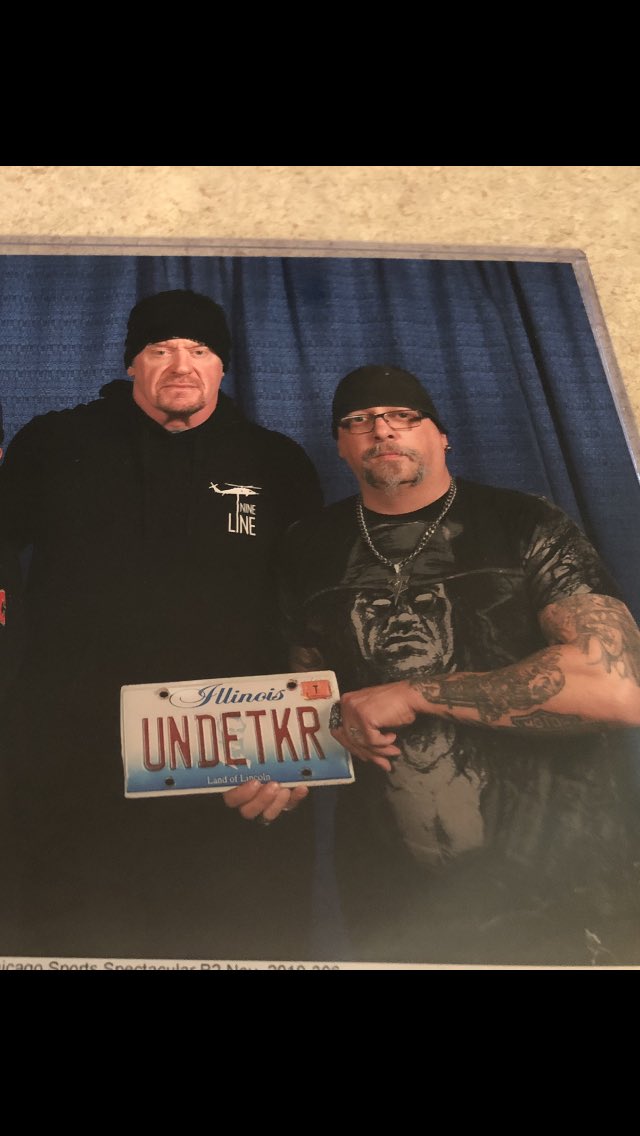 undertaker1877's tweet photo. @davidlagreca1 what I want to be buried with as my wrestling memorabilia is the picture I took with the Undertaker when  I handed him my license plate off my car signed from me to him 2019 https://t.co/nNqmVbZbod